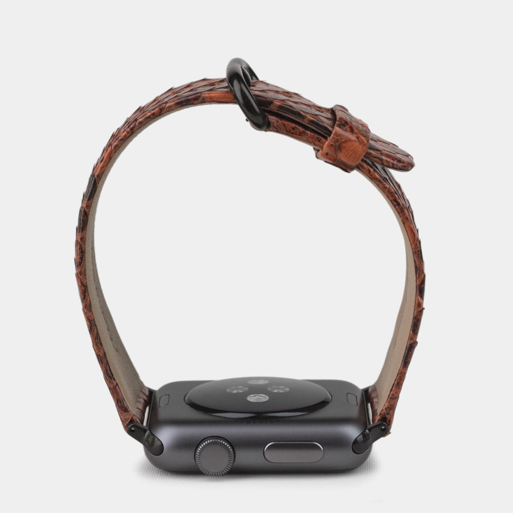 gold  python strap apple watch with black adapters and buckle profile view