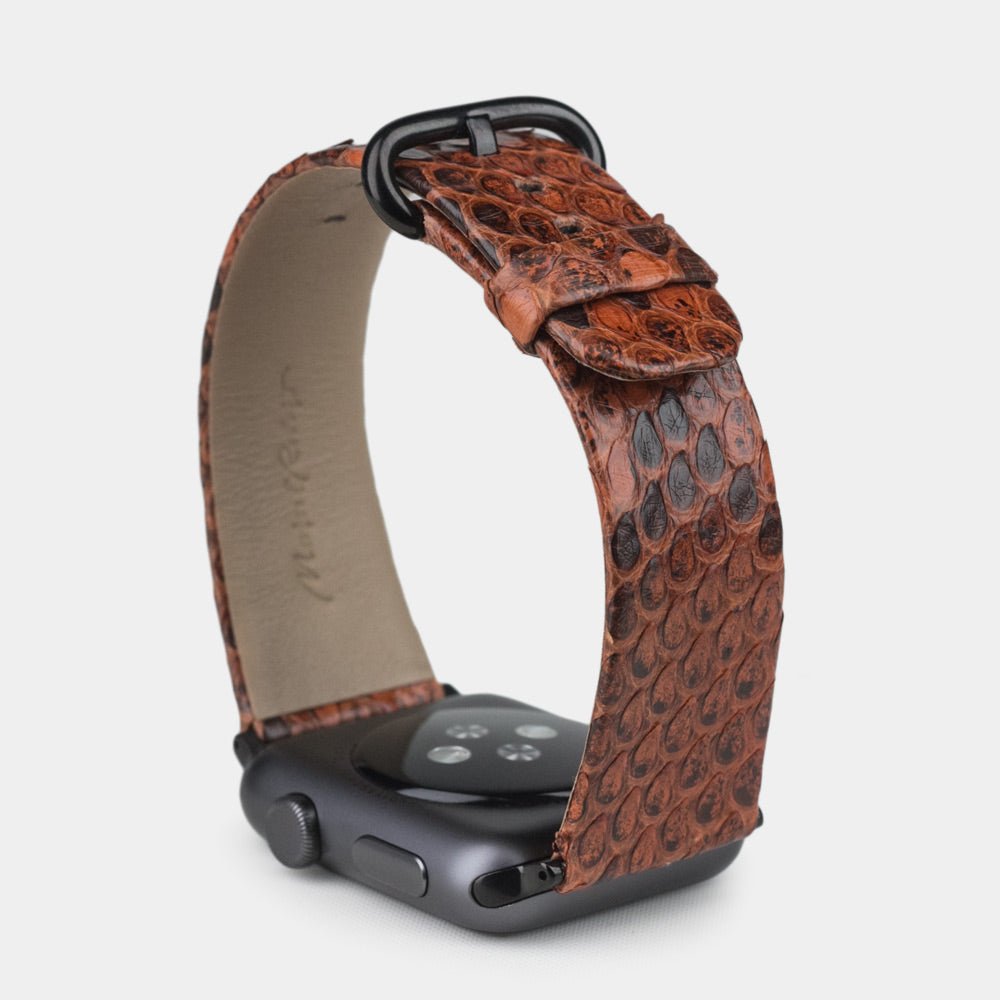 gold  python strap apple watch with black adapters and buckle upper view